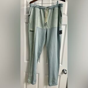 These Civilized sweatpants, size XL, feature a two-tone design with "BAD HABITS